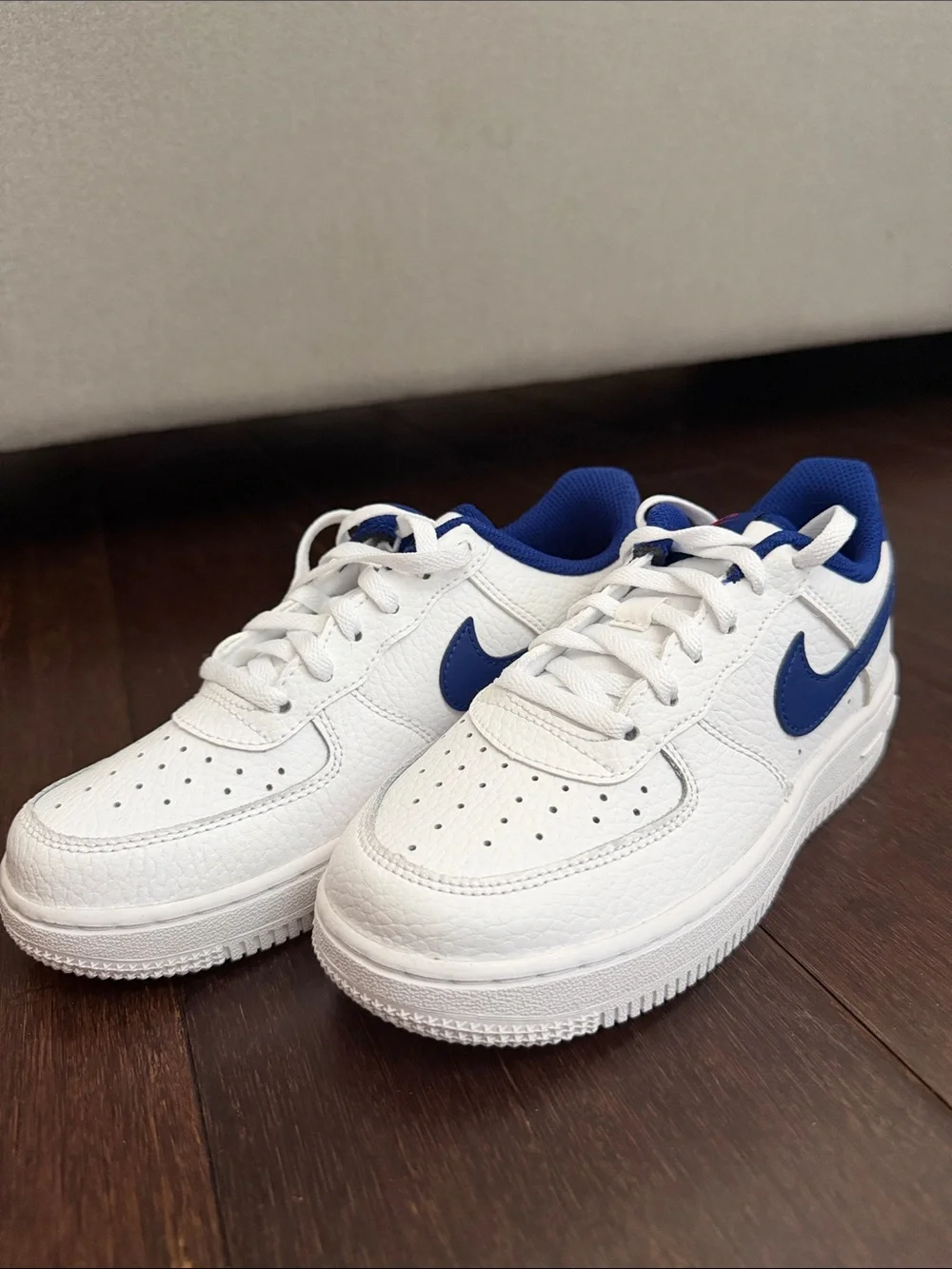 Nike Kids White Sneakers with Blue Swoosh